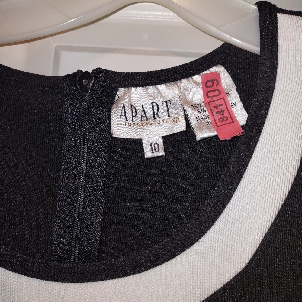 Dressy/casual black/white, form fitted, poly blend dress.
